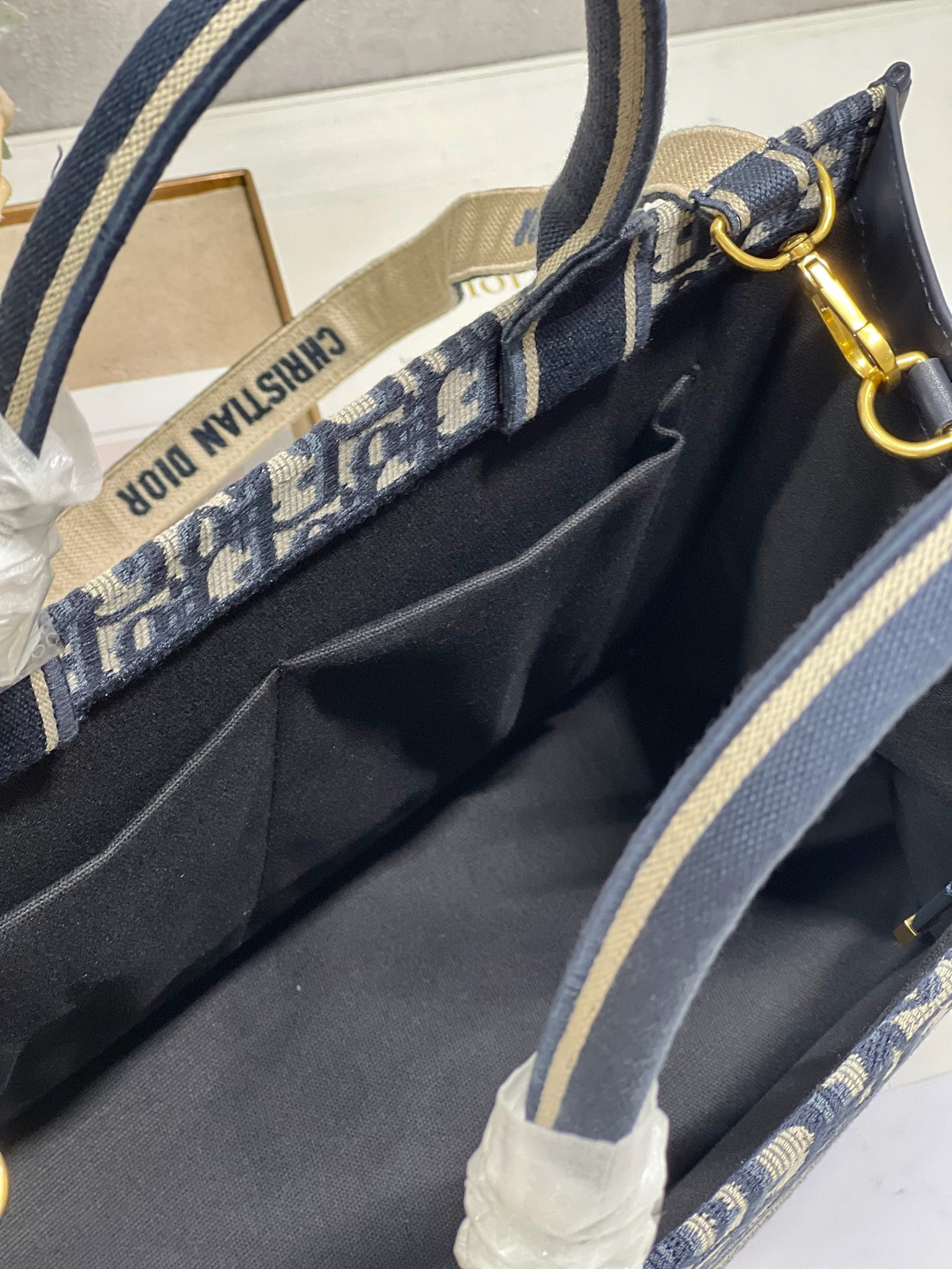 medium D*or book tote ecru and blue D*or oblique embroidery 14 x 11 x 6.5 inches